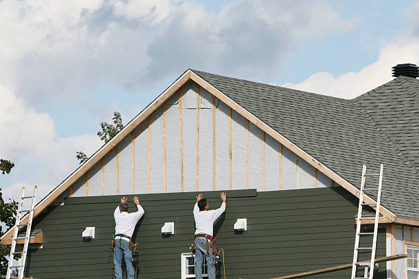 Professional Storm Damage Siding Repair technician working in North Fort Myers, FL